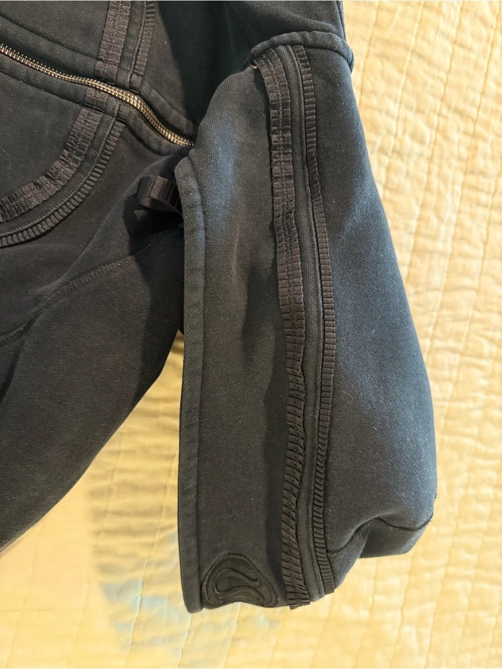 lululemon athletica. Special edition.  black jacket with ruffle trim and hood.